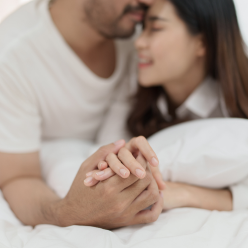 man and woman holding hands